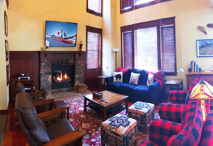 Another Timbers living room with picture windows of golf course